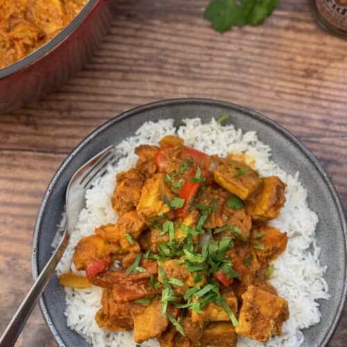 peanut butter tempeh curry with rice in a bowl