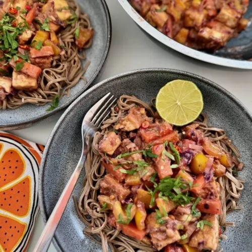 Vegan pad thai served in two bowls